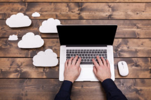 laptop on desk cloud